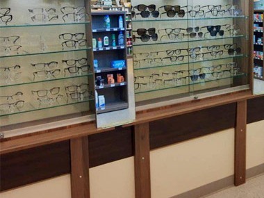 Eyeglasses and sunglasses on the display shelves at Mapleview Optical